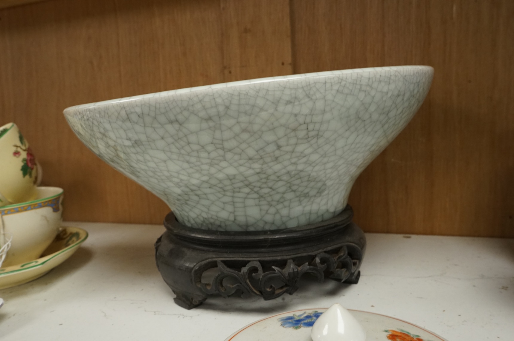 Oriental items to include a crackleglaze bowl on stand and a bamboo brush pot, together with two other vessels, largest 27cm in diameter